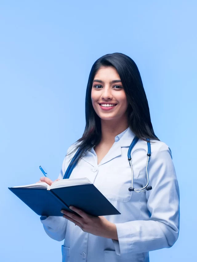 beautiful-young-asian-girl-doctor-with-notebook-records-isolated-blue-background-medical-student-general-practitioner-concept-medical-education-india